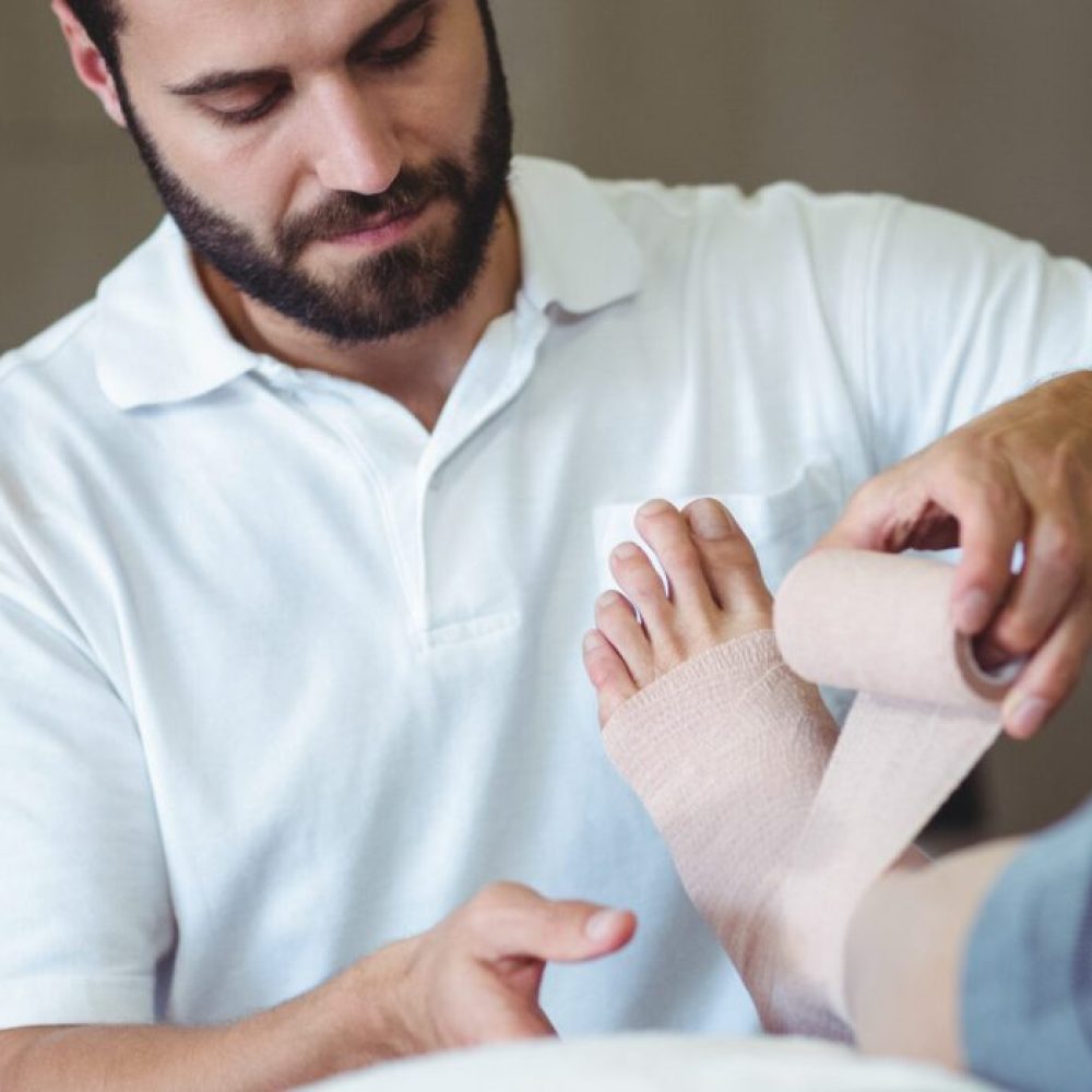 physiotherapist-putting-bandage-on-injured-feet-of-2025-04-03-07-53-23-utc-1-scaled-r9fctf6r9dpszhgckq3hgu4v4hsc4k44ees7qpwf2w physiotherapist-putting-bandage-on-injured-feet-of-2025-04-03-07-53-23-utc-1-scaled-r9fctf6r9dpszhgckq3hgu4v4hsc4k44ees7qpwf2w